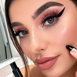 **

Prompt: "A stylish Instagram influencer showcasing a new mascara product in a bright, modern bathroom. Focus on makeup details and the influencer's engaging expression. Convey trustworthiness and relatable beauty."

**